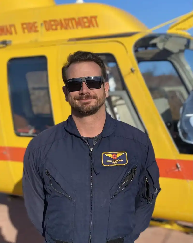 a man standing in front of a school bus
