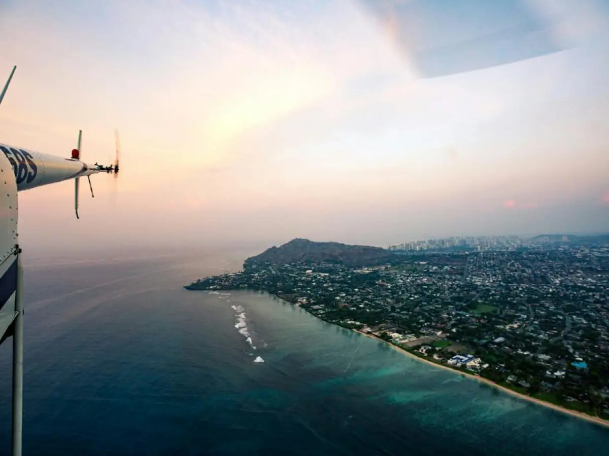 a plane flying over a body of water